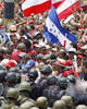 Honduran Coup Regime Blocks Ousted President Zelaya's Return; Troops Open Fire on Supporters at Airport, Killing Two