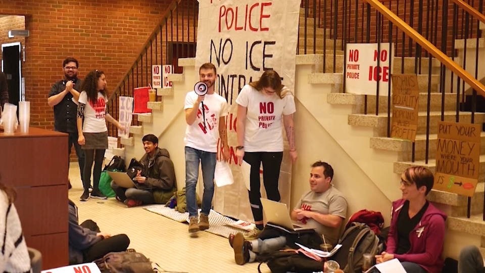 H16 john hopkins sit in protest armed cops ice contracts