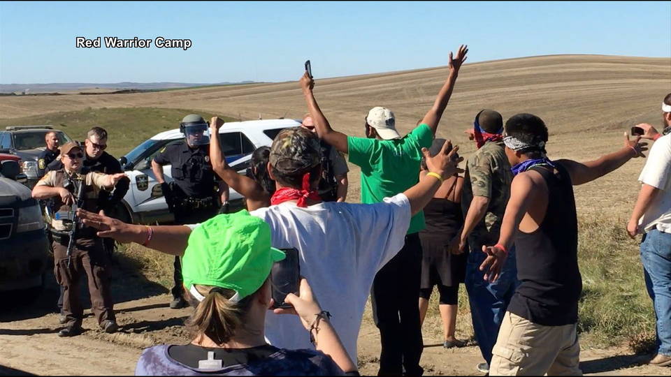 H15 standing rock hands up