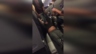 H12 united passenger dragged