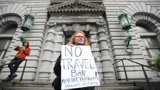 S6 travel ban courthouse sign