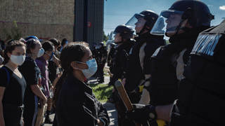 Seg2 protester police staredown