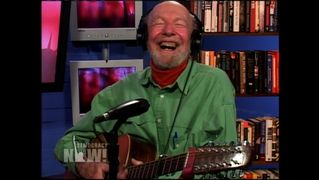 Seeger with guitar